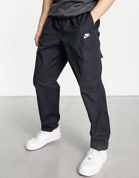 Trousers & Chinos by Nike Nike Club woven cargo trousers in black Style refresh: pending Regular rise Elasticated waistband Functional cargo pockets Logo embroidery Roomy cut for ease of movement and comfort Panelled leg construction Regular, tapered fit Cargo Nike, Mens Club, Cargo Trousers, Black Style, Logo Embroidery, Nike Pants, Embroidery Logo, Cargo Pants, Black Fashion