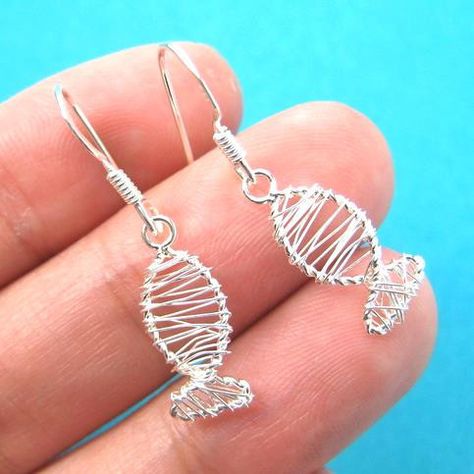 A pair of sterling silver fish shaped wire wrapped dangle earrings! They are made in the shape of a fish and are simple, cute and allergy free! For more sea themed animal jewelry please visit our stor Geometric Silver Jewellery, Silver Jewelry Diy, Bijoux Fil Aluminium, Ring Opal, Silver Fish, Sterling Silver Wire Wrap, Diy Wire Jewelry, Silver Gemstone Jewelry, Homemade Jewelry