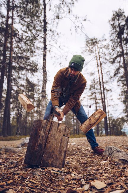 Young man chopping wood in the forest ... Man Chopping Wood Aesthetic, Man In The Woods Aesthetic, Chopping Wood Pose, Chopping Wood Aesthetic, Man Chopping Wood, Man Gardening, Snow Story, Christmas Tree Photoshoot, Wood Chop