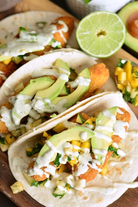 Crispy Fish Tacos with Cucumber Mango Relish. These tacos are made with crispy fish fingers, sweet and spicy cucumber mango relish, fresh avocado, and topped with avocado cilantro crema. #fishtacos #crispyfish #cod #fishsticks #tacos #mangorelish Fishsticks Meals, Lunch Tacos, Spicy Relish, Mango Tacos, Mango Relish, Salmon Mango, Taco Quesadilla, Cilantro Crema, Veggie Turkey