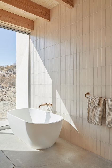 From soft, neutral tile to a sunlit soaking tub to the simplicity of the Odin® Bath Collection, every element of artist Heather Day’s home celebrates the stark beauty of the desert.

Photography: Joe Fletcher

Luxury Bathroom; Minimalist Bathroom; Desert Oasis; Floor to Ceiling Bathroom Windows; Interior Design; Exposed Wood Beams Ivory Bathroom, Handmade Tile Backsplash, Beams Ceiling, Desert Modernism, Heather Day, Exposed Beams Ceiling, Tile Accent Wall, Tile Backsplash Bathroom, Bathroom Tile Inspiration