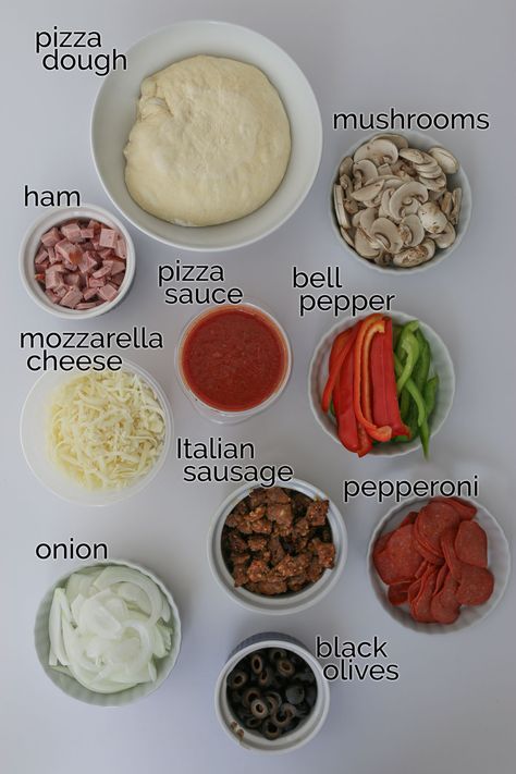 Make pizza night super duper out of this world with this Homemade Supreme Pizza recipe featuring a hearty combination of vegetables and meat. This recipe is a great DIY alternative to the pizzeria classic that you can customize supreme pizza toppings to your personal preferences -- without paying extra! Supreme Pizza Toppings, Pizza Diy Homemade, Make Ur Own Pizza, All Meat Pizza, Homemade Pizza Ingredients List, Pizza Topping Ideas Homemade, Pizza Ingredients List Recipe, Goofy Movie Pizza Recipe, Homemade Pizza Recipe Toppings