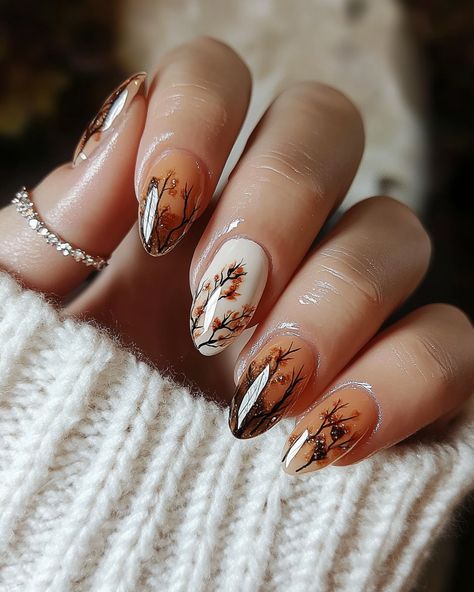 Get inspired by this stunning fall nail art with rich, warm autumn tones and elegant floral details. The perfect mix of glossy finishes and subtle glitter adds a touch of luxury to these oval-shaped nails. This manicure is ideal for the fall season, offering a chic yet cozy vibe. Perfect for anyone looking to embrace the autumn spirit with a stylish twist. 🍂 #fallnailart #autumnnails #fallmanicure #halloweennails #floralnails #falltrends2024 Fall Floral Nails, Nail Design For Fall, Floral Nail Design, Autumn Nail Art, Oval Shaped Nails, Autumn Spirit, Nails Elegant, Autumn Tones, Autumn Nail