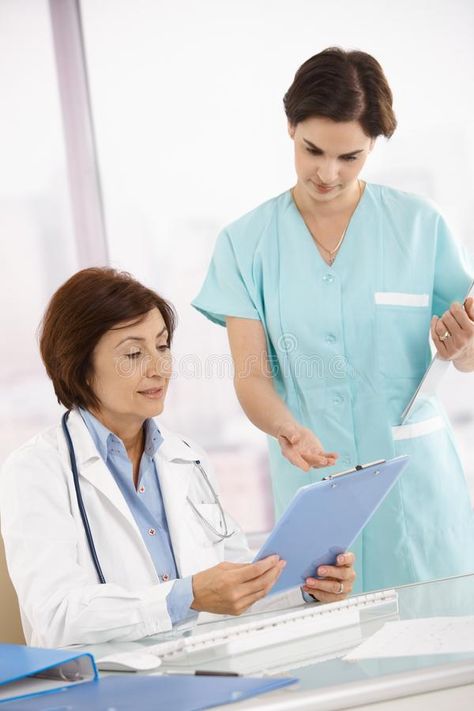 Doctor and assistant discussing work. Senior doctor and assistant discussing wor #Sponsored , #Affiliate, #paid, #assistant, #doctor, #wor, #discussing Holding Clipboard, Cna Training, Doctor Assistant, Sitting At Desk, Nurse Assistant, Nursing Assistant, Academic Research, Fashion Inspiration Design, Clipboard