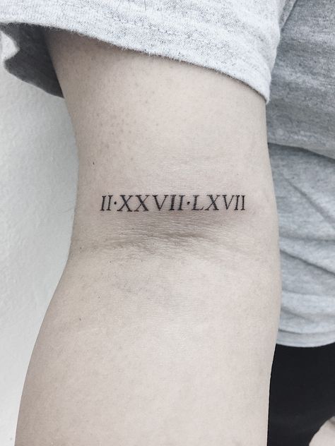 Roman numerals on bicep tattoo Roman Numeral Tattoos Arm, Roman Numeral Bicep Tattoo, Roman Numbers Tattoo Women Arm, Bicep Roman Numeral Tattoo, Roman Numbers Tattoo Women, Forarm Tattoos For Women, Roman Numeral Birthday Tattoo, Roman Numeral Tattoo Arm, Roman Numeral Tattoo Font