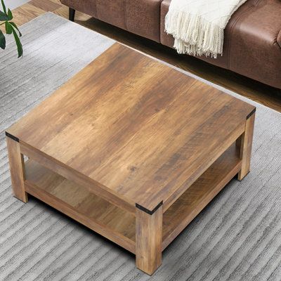 The square farmhouse coffee table features an original wood grain finish and a classic barn-style design with metal corner accents. Its unique square shape is perfectly sized to complement your sofa and fits well in both small and large spaces, including living rooms, bedrooms, offices, and balconies. Color: Oak Wood | Millwood Pines Zara Square Coffee Table w / 2-tier Storage Shelves brownWood in Oak Wood | Wayfair Square Oak Coffee Table, Square Farmhouse Coffee Table, Unique Coffee Table Ideas, Square Wooden Coffee Table, Shelves Brown, Square Wood Coffee Table, Square Farmhouse, Large Square Coffee Table, Farmhouse Coffee Table