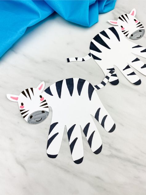 If you're looking for a fun and easy wild animal craft for kids, this handprint zebra craft is perfect! Download the free printable template and make with toddlers, preschool and kindergarten children at home or in the classroom.#simpleeverydaymom #handprintcrafts #wildanimalcrafts #animalcrafts #zebracrafts #kidscrafts #craftsforkids Zebra Craft, Safari Crafts, Jungle Crafts, Zoo Animal Crafts, Pig Crafts, Zebra Art, Animal Crafts For Kids, Handprint Crafts, Craft For Kids