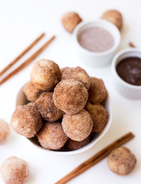 Baked Churro Poppers - a fluffy churro batter baked in the oven and sprinkled with cinnamon and sugar. Dip them in a Mexican chocolate sauce or maple vanilla sauce for an extra delicious treat! Churro Poppers, Apple Cider Donut Muffins, Mexican Chocolate Sauce, Baked Donut Holes, Pumpkin Spice Donut, Donut Muffins, Vanilla Sauce, Spiced Apple Cider, Mexican Chocolate