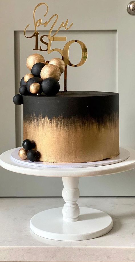 38. Black and gold Whether you’re looking for birthday cake ideas or celebration cakes.  We’ve got something for every occasion. The cake features matte... Happy 50th Birthday Cake For Men, Black N Gold Cake For Men, Cake Design For 60th Birthday For Men, 50th Black And Gold Cake, Cake In Black And Gold, Elegant Black And Gold Cake, Black And Gold 50th Birthday Cake For Men, Black And Gold 80th Birthday Cake, 40th Birthday Cakes For Men Elegant