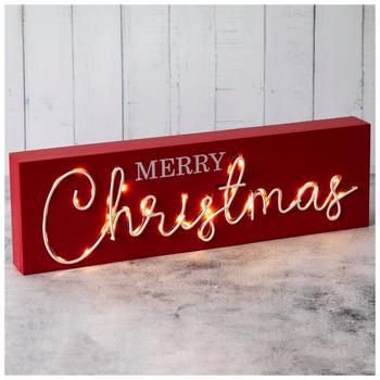 Dimensions: 4.75" H x 15.75" W x 1.63" D Power Source: 2 AAA Batteries (Not Included) Material: MDF & Metal Shape: Rectangle Color: Red & White Orientation: Horizontal Quantity: 1 Brighten up any holiday display with this Light Up Merry Christmas Wood Decor. This rectangular MDF piece is red with the phrase "Merry Christmas" on the front in festive white font. The word "Christmas" is constructed out of metal and has bright white lights behind the letters. Set this on the mantel with a lush cedar garland for the perfect Christmas arrangement! Christmas Wood Decor, Snowy Town, Cedar Garland, Light Up Canvas, Christmas Fonts Free, Hobby Lobby Christmas, Wall Decor Hobby Lobby, Christmas Landscape, Christmas Fonts