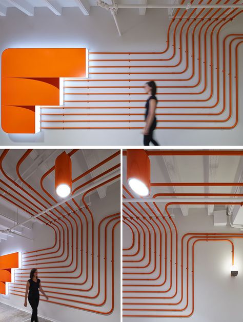 Studio BV have designed the Field Nation offices that were inspired by a circuit board and features orange conduit piping throughout, guiding people to the various areas of the office. #InteriorDesign #OfficeDesign #DesignAccent Orange And Blue Office, Funky Office Design, Office Lighting Ideas, Pipes Design, Gray Interior Doors, Circuit Board Design, Industrial Office Design, Office Branding, Web Banner Design