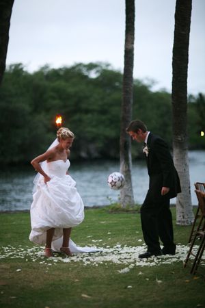 1. A fun and unusual photo of the couple that captures the theme of their wedding. 2. Natural light at almost dusk. 3. Possibly fill flash used. 4. Trees in the background could have easily grown out of one of their heads - but don't. 5. Assume this was a somewhat staged photo. 6. Somewhat shallow depth of field; background out of focus. 7. Wish the chairs were not on the right. Soccer Wedding, Soccer Couples, Football Wedding, Soccer Theme, Soccer Star, Funny Wedding Photos, Photographs Ideas, Amazing Weddings, Funny Wedding