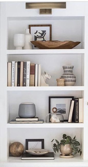 Stylish bookcase Black And Neutral Shelf Decor, Feminin Office Work Spaces, Living Room Built In Cabinets With Doors, Tv Shelf Decorating Ideas, Five Shelf Bookcase Decor, Bathroom Makeup Mirror Ideas, Office Credenza Styling, How To Make Books Look Good On A Shelf, Narrow Dining Room Built Ins