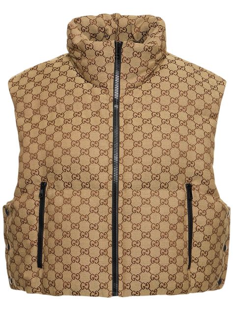 Find Gucci Gg Canvas Down Vest on Editorialist. High collar with concealed hood. Front zip closure. Logo details. Sleeveless. Two side zip pockets. Padded . Lined. Model is wearing a sizeS Gucci Vest, Shoe Storage Hacks, Canvas Vest, Shoe Storage Solutions, Padded Gilet, Versace Brand, Ski Accessories, Walk In Wardrobe, Jackson Hole