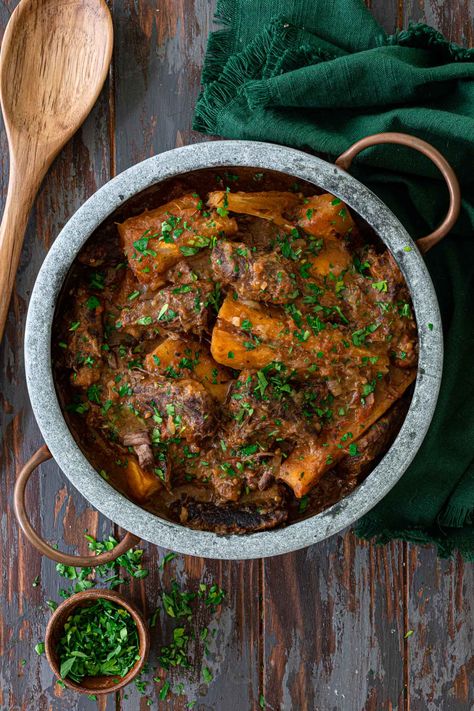 Vaca Atolada (Short Rib Stew with Yuca) | www.oliviascuisine.com | This Brazilian Short Rib Beef Stew with Yuca is the ultimate cold weather comfort food! Slow cooked in a Dutch oven until the beef is succulent and fall-apart tender, this dish will quickly become a family favorite. Serve it over rice, buttered noodles or along a nice crusty bread to soak up the savory sauce. #beefstew #yuca #brazilianfood #beef #dutchoven #stews Short Rib Beef Stew, Short Rib Stew, Heritage Recipes, Brazilian Recipes, Cold Weather Comfort Food, Hearty Beef Stew, Buttered Noodles, Mexican Heritage, Short Rib