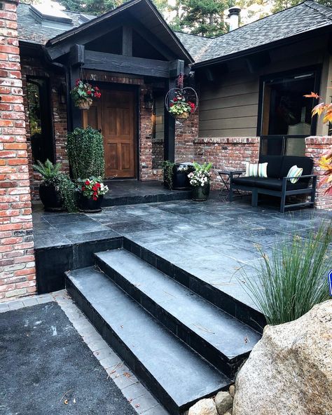 Before and after of the cracked front porch. Replaced with this stunning 2 inch thick black basalt natural stone. Landscaping Entrance, Front Door Landscaping, Front Porch Stone, Concrete Front Porch, Outside Tiles, Paint Concrete Patio, Patio Stairs, Stone Porches, Concrete Patio Makeover