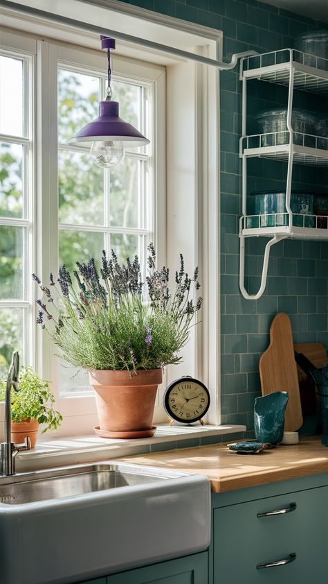 Elevate your kitchen with the calming beauty of lavender! This sunny windowsill setup features potted lavender alongside a practical KUNGSFORS rail system and sleek GRUNDTAL shelves, creating an organized yet stylish space. The quirky clock and SINNERLIG pendant lamp add unique touches, bathing the area in natural light for a fresh, vibrant atmosphere. Discover how to incorporate these elements into your own kitchen for a perfect blend of functionality and aesthetics. Click for more inspiration! #IKEAStyle #KitchenInspo #LavenderLove Sinnerlig Pendant, Potted Lavender, Kitchen Vibes, Plant Display Ideas, Potted Houseplants, House Plant Care, Stylish Kitchen, In Kitchen, Balcony Garden