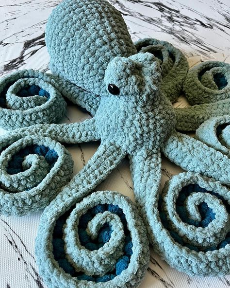 A crocheted octopus, sitting with its tentacles curled. The octopus is made with two tones of teal yarn. Crochet Kraken Pattern, Crochet Octopus Realistic, Realistic Octopus Crochet Pattern, Free Octopus Pattern, Large Octopus Crochet Pattern Free, Free Crochet Octopus Pattern, Giant Octopus Crochet Pattern, Octopus Crochet Pattern Free, Crochet Octopus Pattern