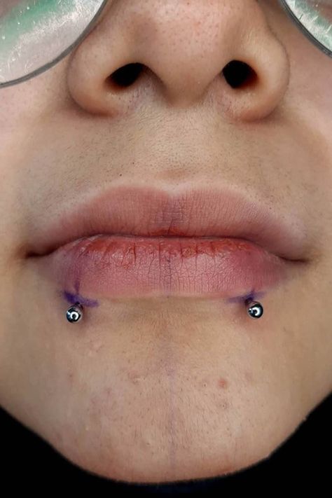 Many of you have heard about snake bites piercing. Some of you may have even considered getting those. However, only a few know all the details concerning the procedure, care, and related things. Do you want to join the ranks of snake bite piercing experts? #snakebitespiercing #snakebitepiercingideas #facepiercing #facepiercingideas #lippiercing Snake Bites Small Lips, Snake Bites On Small Lips, Snake Bite Piercing Men, Snakebites Men, Snake Piercing Lip, Snake Bites Men, Angel Fangs And Snake Bites, Snake Bites Lip Piercing, Angel Fangs