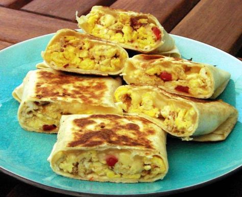 Scrambled Egg Wrap. We had a sandwich like this on vacation with avocado - which I will add if I make this. Scrambled Egg Tortilla Wrap, Scrambled Egg Wrap, Baked Omelette, Egg Wraps, Egg Wrap, Eggs Breakfast, Wrap Recipe, Scrambled Egg, Breakfast Bites