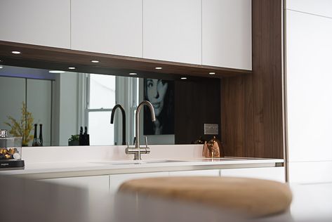 Smoky mirror splashback in contemporary white kitchen. Walnut and quartz worktop. Gravesend, Kent White Kitchen With Mirror Splashback, Smoky Mirror Splashback Kitchen, Mirror Splashback Kitchen, Smoky Mirror, Bus Kitchen, Gravesend Kent, Deco Rumah, Antique Mirror Splashback, Kitchen Walnut