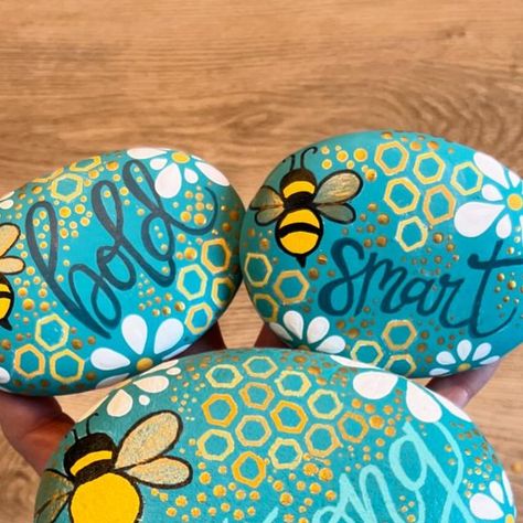 Danielle Bordenave on Instagram: "Bee Strong, Bee Brave, Bee Bold.  Had so much fun the the prior #bee #paintedrocks I did a few more inspired by the motto of @girlsinc.carp #rockpainting #handlettering" Bee Rock Painting, Bee Strong, Rock Artwork, Bee Rocks, Painting Words, Rock Ideas, Carp, Rock Painting, Rock Art