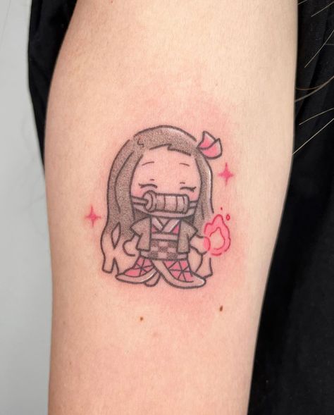 Tattoo by @pigeonpokes_ on Instagram, who is based in Singapore. Small Cute Japanese Tattoos, Small Nezuko Tattoo, Anime Tattoo For Women, Anime Tattoos Women, Minimal Anime Tattoo, Nezuko Tattoo Ideas, Nezuko Tattoo Design, Minimalist Anime Tattoos, Small Demon Slayer Tattoo