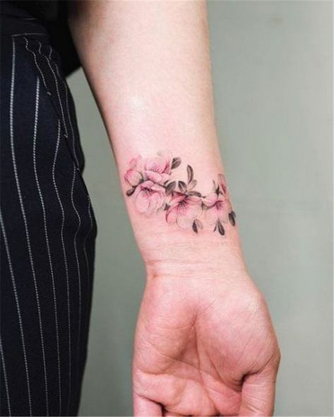 Beautiful 70 Gorgeous Flower Wrist Bracelet Tattoos for Women Ideas Cherry Blossom Tree Tattoo, Small Wave Tattoo, Wrist Bracelet Tattoo, Meaningful Wrist Tattoos, Cool Wrist Tattoos, Flower Wrist Tattoos, Vine Tattoos, Wrist Tattoos For Women, Floral Tattoo Design