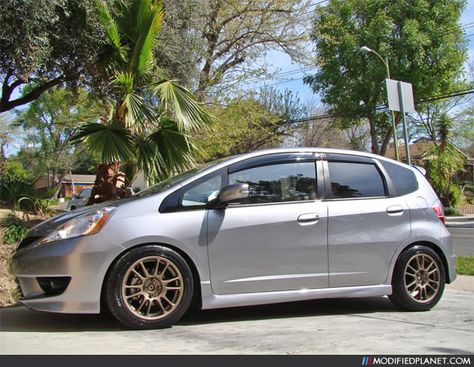 Tidewater Blue Metallic 2009 Honda Fit sitting on a set of bronze 16″ x 7″ A-Tech Final Speed Gear-R wheels with a +43 offset. The A-Tech Final Speed Gear-R wheels are wrapped in 205/50/16 Dunlop Direzza Sport Z1 Star Spec tires. Car Photo Submitted by: Unknown via Submission Page Jan 31, 2011Modified Planet Honda Fit Sport Modified, 2009 Honda Fit, Honda Fit Sport, Car Photo, Honda Jazz, Racing Wheel, Honda Fit, Car Photos, Tires