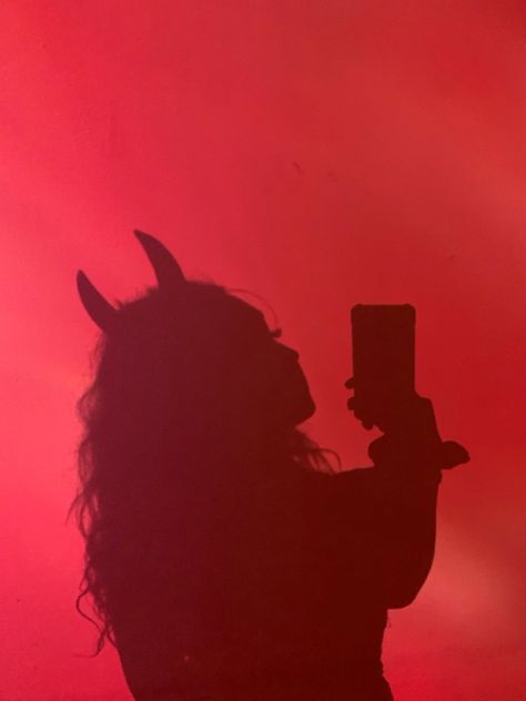 a red background with a shadow of a girl wearing devil horns for a halloween costume Devil Halloween Costume Aesthetic, Red Horns Aesthetic, Dark Devil Costume, Red Devil Aesthetic, Red Aesthetic Photoshoot, Devil Costume Aesthetic, Devils Costume, Lucifer Costume, Devil Photoshoot