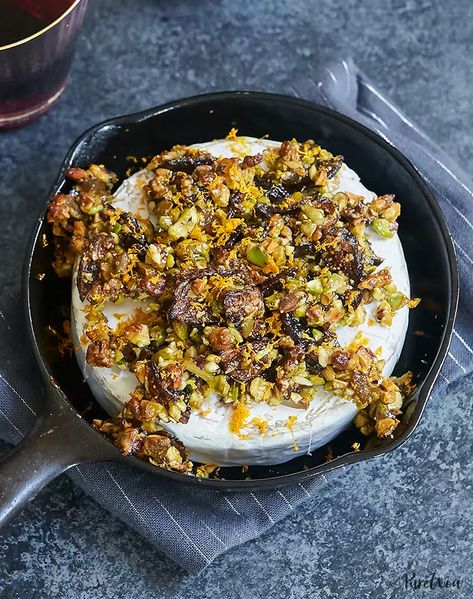 Baked Brie with Figs, Pistachios and Orange - PureWow Cheese Recipes Appetizers, Baked Brie Recipes, Fancy Appetizers, Christmas Appetizers Party, Brie Recipes, Fall Appetizers, Fig Recipes, Baked Brie, Thanksgiving Appetizers