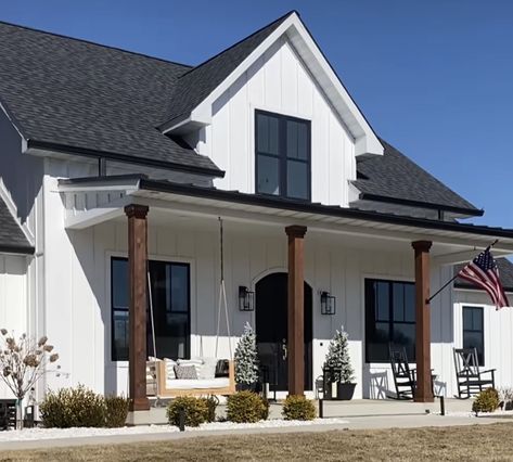 Black Painted House Exterior, White And Black Farmhouse Exterior, Black Painted House, House Exterior With Porch, Painted House Exterior, Black Farmhouse Exterior, White And Black Farmhouse, Exterior House Renovation, Lake Houses Exterior