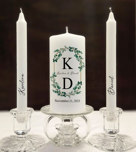 Candles are symbols of Romance and beauty. Personalized Unity candle sets are perfect for your wedding day decoration to show your guests that your two souls are becoming united as one from this day! Add a touch of beauty and elegance to your special day with this classic hand made personalized unity candle set with your initials, names and your special date on it! Wedding Unity Candle, Unity Candles, Candles Wedding, White Pillar Candles, Feuille Eucalyptus, Wedding Unity Candles, Eucalyptus Leaf, Unity Candle Sets, Green Eucalyptus