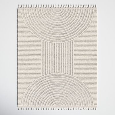 Add an earthy yet elevated accent to your space with this cream and light gray colored area rug. It's power-loomed from polypropylene with a high-low design that showcases stripes and arches for a textured look we love. The plush pile height is just right for sinking your toes into as you hop out of bed, and the tasseled edges give this rug a boho look we love. Plus, it's safe to use with heated floors, and it's stain-resistant, so it's a smart choice in homes with kids and pets. Rug Size: Recta Cream Bedroom Ideas, Cream Bedrooms, Zen Den, Cream Bedding, Minimalist Nursery, Neutral Area Rugs, Room Deco, Cream Area Rug, Heated Floors