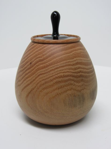 This a neat little lidded box made of an unknown wood, that would make a great trinket box or small pet urn, or just a shelf decoration. The lid of this piece is extremely tight fitting so it wouldn't make for a good in and out of box. The dimensions are 3.75" tall without lid and 5.25" with lid. Slightly less than 4" in diameter at the widest point with an opening of 1.75" and a depth of 3". Artist name and year are laser engraved on the bottom.   Thanks for looking! Wooden Pot, Shelf Decoration, Pet Urn, Pet Urns, Small Pet, Organization Boxes, Shelf Decor, Storage And Organization, Trinket Boxes