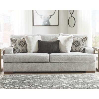 This sofa features clean lines and deep seating for a modern look in your living room. The solid and engineered wood frame rests on wide, brown-hued legs, and it's wrapped in a weathered gray polyester blend with a subtle chevron design. This sofa has foam-filled cushions supported by sinuous springs for plenty of giving while you sit. They're also removable for easy cleaning. We love how the recessed arms and pillow back give this sofa a modern silhouette. Plus, this sofa includes five square t Ashley Sofa, Relaxed Aesthetic, Designer Sofa, Chair And A Half, Grey Upholstery, Sofa Styling, Living Room Set, Gray Sofa, Toss Pillows