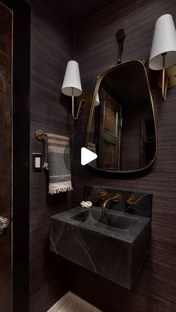 Mary Best on Instagram: "TINY POWDER ROOM reveal! Dark and moody gives sophistication to this 4’ x 6’ space. Nero black marble floating sink + un lacquered brass fixtures is perfectly timeless and dramatic. The grasscloth wallpaper introduces a rich tactile dimension adding depth. Natural yet refined at its BEST!" Moody Powder Room Wallpaper, Small Powder Room Remodel, Powder Room Floating Vanity, Elegant Powder Room Ideas, Moody Powder Room, Elegant Powder Room, Tiny Powder Room, Powder Room Remodel, Floating Sink