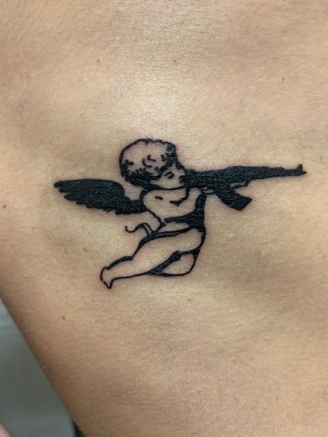 Angel ak47 tattoo weapon Revenge Tattoo, Ak47 Tattoo, Minimal Tattoo Ideas, Tatuagem Masculina Pequena, Back Of Arm Tattoo, Girl Face Tattoo, Gangsta Tattoos, Graffiti Tattoo, Dope Tattoos For Women