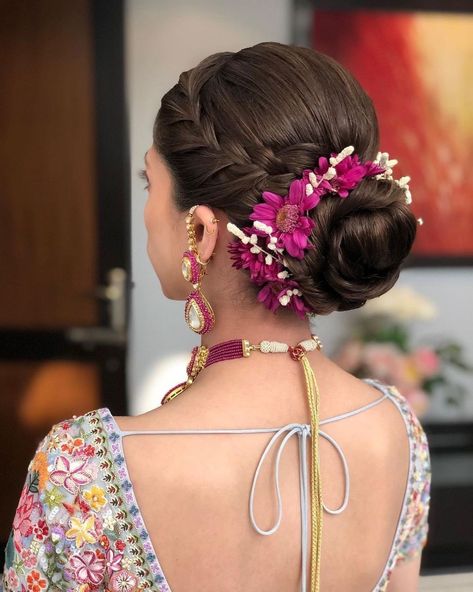 Trending: Floral Buns That Won't Bog You Down | WedMeGood Floral Hair Bun, Floral Bun, Reception Hairstyles, Saree Hairstyles, Blooming Bouquet, Bridal Makeup Images, Bridal Bun, Indian Bridal Hairstyles, Haircuts Straight Hair