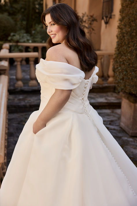 Bring your dream fairytale wedding to life with our timeless Ariane gown. Ariane's ballgown silhouette will have you feeling like royalty on your special day. An off-shoulder beauty with a sweetheart neckline featuring visible boning and organza that drapes perfectly across the bodice, making you feel like the bride of your dreams. Take off the detachable off-shoulder straps for a timeless strapless look. Thought Ariane couldn't get any more perfect? She also has pockets! Off The Shoulder Ballgown Wedding Dress, Masquerade Dress, Puffy Wedding Dresses, Blue Ball Gown, Bridal Gown Styles, Sophia Tolli, Disney Weddings, Blue Ball Gowns, Wedding Dress Guide