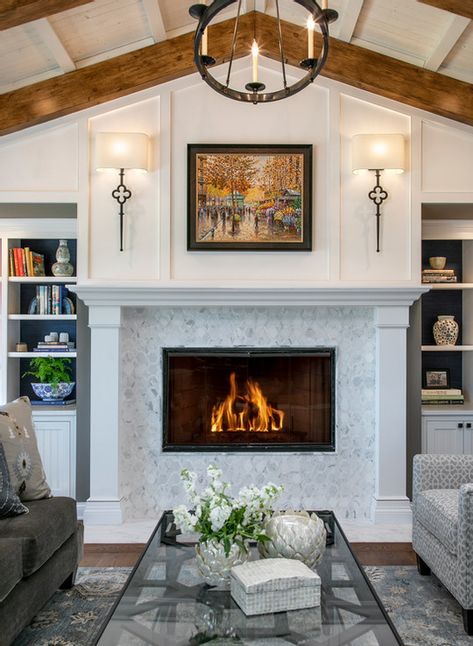 Wine Country Living fireplace with white painted mantle and wood paneling, marble tile surround and built in bookcases. Vaulted ceiling with beams. | Wine Country Living Painted Mantle, Vaulted Ceiling Beams, Vaulted Ceiling Ideas, Vaulted Ceiling Living Room, Fireplace Built Ins, Interior Remodel, Wood Fireplace, Home Fireplace, Built In Bookcase