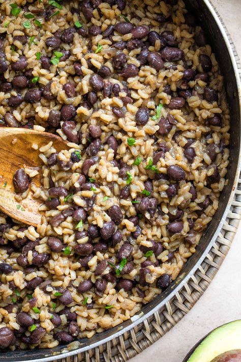 Try Gallo Pinto - the famous Costa Rican Rice and Beans recipe! This version was taught to us by a Costa Rican exchange student – her treasured, authentic family recipe. It’s super-easy, DELICIOUS and ready in less than 10 minutes! It’s often served as a Costa Rican breakfast, but it’s eaten any time of day – breakfast, lunch or dinner – as a side dish or a hearty vegetarian main course. And, it keeps great for days, so it’s a perfect make-ahead recipe for meal prep! | www.TwoHealthyKitchens.com Rice And Beans Breakfast, Chicken Rice And Beans Recipe, Costa Rica Black Beans, Costa Rican Black Beans, Costa Rican Chicken, Costa Rican Rice And Beans Recipe, Costa Rican Dishes, Costa Rica Recipes, Easy Costa Rican Recipes