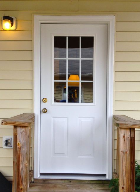 A simple white steel Provia side entry door with two embossed panels and half glass with internal grids. White Front Doors, Front Door Side Windows, Front Door With Glass, White Front Door, Steel Doors Exterior, White Exterior Houses, Exterior Doors With Glass, Glass Panel Door, Front Doors With Windows