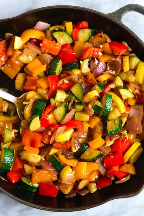 Easy sautéed vegetables recipe! We love this dish with onion, zucchini, bell pepper, and garlic, but you can substitute or add your favorite vegetables. These sautéed veggies are […] Cast Iron Skillet Vegetables, Assorted Vegetable Recipes, Sauteed Zucchini And Peppers, Zucchini Mixed Vegetables, Bell Pepper Zucchini Onion, Cooking Fresh Vegetables, Peppers And Zucchini Recipes, Bell Peppers And Onions Recipes, Healthy Sauteed Vegetables