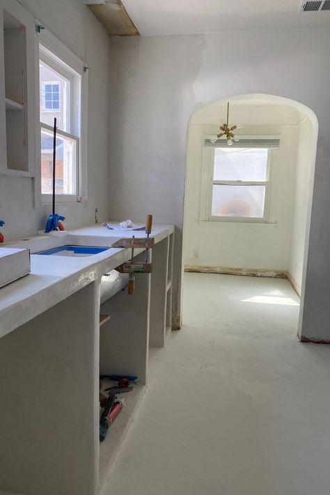 Blanco Bungalow Kitchen Renovation: Week 7 — Blanco Bungalow Spanish Bungalow Kitchen, Concrete Cabinets, Kohler Sink, Filtered Water Faucet, Single Basin Sink, Spanish Bungalow, Bungalow Kitchen, Smooth Concrete, Brass Faucet