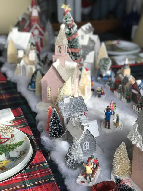 Christmas Village Tablescape Christmas Village Dinner Table, Christmas Village Tablescape, Christmas Village Table Centerpiece, Village Theme Decoration, White And Red Decorations, Christmas Village Theme, Village Tablescape, Christmas Village Table, Family Room Coffee Table