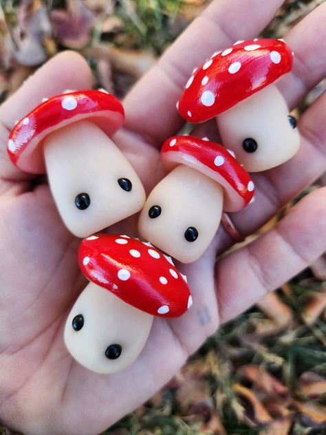 Magical mushroom friends that make the best desk pet, car accessory, or wherever you need a little smile! These friends have little eyes and their tops come in either red or blue with a shimmery top coat.  Mushroom spots will vary and are larger than the first picture.  We are nearly always processing over 100 orders which are all made by hand so please allow 7-9 business days for us to make your new friend. Mini Modeling Clay Ideas, Cute Mushroom Stuff, Cute Mushroom Crafts, Mushroom Clay Art, Mushroom Stuff, Mushroom Polymer Clay, Clay Mushrooms, Mushroom Core, Fimo Kawaii