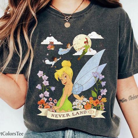 Peter Pan Tinker Bell Never Land Flowers and Flight Shirt Check more at https://wondermento.com/product/peter-pan-tinker-bell-never-land-flowers-and-flight-shirt/ Bell Flowers, Epcot Shirts, Bell Design, Comfort Colors Sweatshirt, Beach Sports, Funny Vintage, Tinker Bell, Youth Hoodies, Mens Long Sleeve Tee