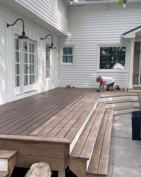 Allie on Instagram: "Porch refresh complete!! This deck needed staining so badly. It had been 7 years since we originally did it, and I’ve learned a few things since then! Swipe right to see the before and after. 😳Sharing all of my tried and true tips and techniques in my recent blog post, as well as saved in my staining highlight. Also sharing how we keep our wood in such good shape. . The exterior of our home is the first impression we give people. Taking the time to spruce it up is definitel Two Tone Deck Stain Ideas, Porch Stain, Porch Refresh, Wooden Porch, Staining Deck, Farmhouse Porch, Swipe Right, Tried And True, First Impression