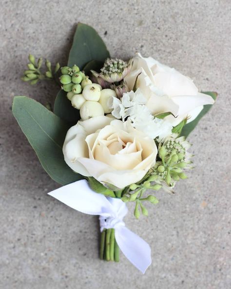 A sweet white and green boutonnière: white Majolica spray roses, white statice, snowberries, white astrantia, and seeded eucalyptus Spray Roses Boutonniere, Green Boutonniere, White Corsage, Pink Boutonniere, Prom Corsage And Boutonniere, Rose Boutonniere, Corsage And Boutonniere, Boda Mexicana, Corsage Prom